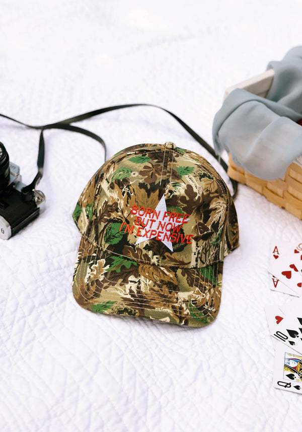 BORN FREE BUT NOW I’M EXPENSIVE Trucker Hat