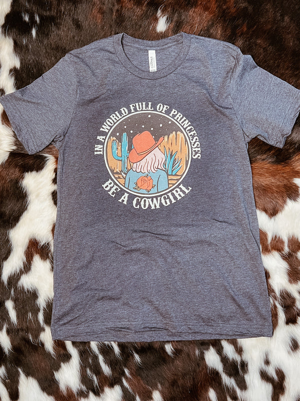 In A world full of princesses be a cowgirl Graphic Tee